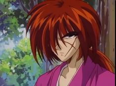 an anime character with red hair and black eyes looking at the camera in front of trees