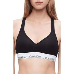 Highly Sought After, Highly Comfortable Bra With Instantly Recognizable Calvin Klein Logos And Push-Up Padding For A Flattering Lift. Made Of Cotton, Modal, Polyester And Elastane.Wireless, Contour/T-Shirt Cup Has A Medium Graduated Push-Up Bump Ridge Along Bottom And Side For Enhanced Cleavage.Cotton-Blend Cup Overlay Has A Soft, Smooth Finish.Flattering Neckline With A Tall Center Front.Exposed Elastic Calvin Klein Underband Secures Fit And Lends Light Support.Sides And Back Are Self-Lined Wit Calvin Klein Long Sleeve Bra, Teen Clothing Stores, Calvin Klein Sports Bra, Calvin Klein Bra, Buy Clothes Online, Cotton Bralette, Padded Bralette, Comfortable Bras, Black Bralette