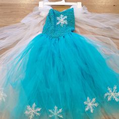 It Is A Super Puffy Layered Elsa Dress. Very Pretty And Princes Feeling. The Body Part Is Soft Knitted With A Lining And It Is Stretchy. The Skirt Has A Soft Lining As Well. Straps Are Adjective. Can Fit Girls From Age 7-12. New With Tag. Great Not Just For Halloween But A Princess Theme Party. Good Quality Piece, Not Cheap Halloween One-Time Using Custom Material. Girls Will Love It~ White Winter Dress For Dress-up Occasions, Winter Princess Style Fitted Tutu Dress, Blue Princess Dress For Winter, Blue Winter Princess Dress, Cute Blue Tutu Dress For Dress-up, Cute Sleeveless Winter Dress, Elsa Style, Smocked Christmas Dresses, Recital Dress