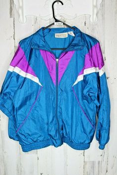 Good condition. No rips. No stains.  A) Shoulder to bottom seam (inches)  24   B) Pit to Pit (inches)   23  C) Shoulder to sleeve bottom.  (inches)  22                                                                                      # Blue Retro Track Jacket For Spring, Blue Violet, Vintage Jacket, Medium Blue, Blue Purple, Nike Jacket, Blue And Purple, Vintage Ladies, Athletic Jacket