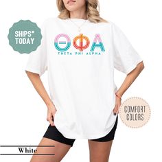 a woman wearing a white shirt with the word ooaa on it and an image of