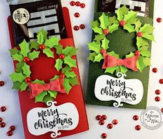 two christmas candy bags decorated with holly wreaths