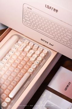 a white computer keyboard sitting on top of a desk