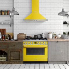 a yellow stove top oven sitting inside of a kitchen