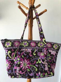 Vera Bradley Miller Bag Purple Punch  pattern - retired March 2011 Slip pocket on front Six pockets around interior Sturdy removable base for stability Zip closure Measures 24" x 13 1/2" x 8"  per Vera catalog "Vera Bradley" label sewn inside Wonderful bag!  It's my personal favorite for a carry-on or gym bag.  So many pockets and so much room. Beautiful retired pattern. Excellent pre-owned condition.  No wear, tears, stains, fade.    I am not affiliated with Vera Bradley and do not represent th Purple Tote Shoulder Bag, Purple Tote Shoulder Bag With Removable Pouch, Purple Travel Bag With Top Carry Handle, Purple Tote Shoulder Bag For Shopping, Purple Shoulder Bag With Double Top Carry Handles, Purple Shoulder Bag With Double Top Handles, Purple Bags With Top Carry Handle, Purple Shoulder Bag With Double Handle, Purple Bags With Handles For Errands