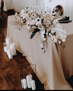 a table with candles and flowers on it