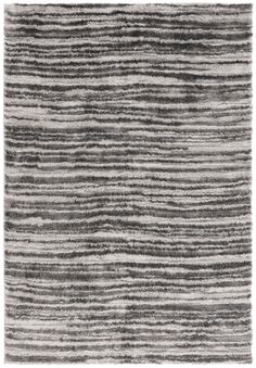 an area rug with grey and white stripes