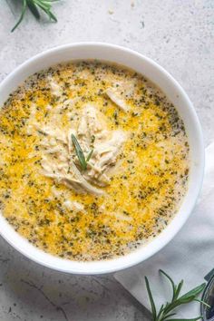 a white bowl filled with soup on top of a table