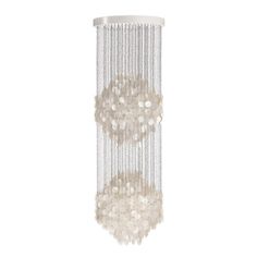 a white chandelier with beads hanging from it's sides and the lights on