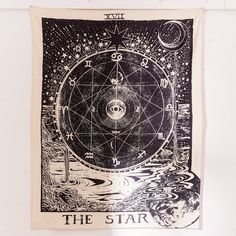 the star tarot is hanging on a wall in front of a white background with black lettering