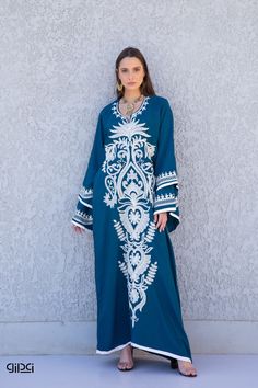 "A flashy extremely vibrant and unique caftan that will make you feel like true royalty. This white embroidered caftan with its unique flared sleeves and vibrant embroidery throughout is a a true stunner! It is an extremely comfortable wear, light and soft and can be used on many occasions -  home gatherings, festival parties, summer occasions, dinners, or just in your home to feel comfortable.  Fabric : 80% Egyptian Cotton; 20% Polyester. Kaftan measurements in inches : -----------Medium------- Blue Long Sleeve Thobe For Eid, Bohemian Maxi Dress With Dabka, Embroidered Maxi Length Blue Abaya, Blue Embroidered Floor-length Maxi Dress, Blue Embroidered Maxi Dress For Eid, Blue Maxi Length Abaya For Spring, Blue Embroidered Long Abaya, Blue Long Sleeve Thobe For Spring, Blue Maxi Dress For Eid