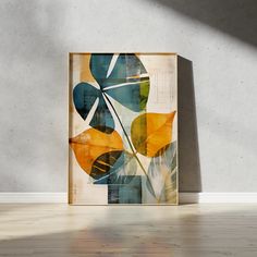 an abstract painting is displayed on the wall in front of a white background with a wooden frame