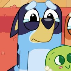 a cartoon dog holding a green object in his hand and looking at the camera man