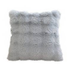 a gray pillow with fluffy fur on the front and back, sitting on a white background