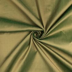 a close up view of a green fabric