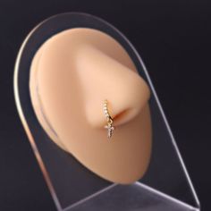 ✦ Adorn your look with our exclusive collection of 18k gold-plated dangle Hoop Nose Rings, shining in both classic silver and luxurious gold finishes. Our meticulously crafted assortment includes a variety of designs to match every mood and style: elegant Heart nose ring, whimsical Wing nose ring, celestial Moon nose ring, symbolic Cross nose ring, blooming Flower nose ring, radiant Star nose ring, delicate Feather nose ring, regal Crown nose ring, and more. Ideal for those who value sophisticat Modern Small Hoop Gold Piercings, Modern Gold Small Hoop Piercings, Gold Diamond Hoop Piercings, Gold Huggie Earrings With Halo Detail, Gold Huggie Earrings With Halo In Fine Jewelry Style, Gold Halo Huggie Earrings Fine Jewelry, Gold Cubic Zirconia Hoop Septum Ring, Gold Hoop Piercings With Prong Setting, Gold Hoop Septum Ring With Prong Setting