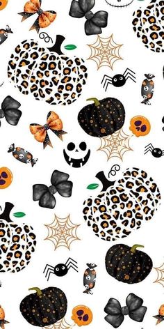 a halloween themed wallpaper with pumpkins, bats and spider webs on it