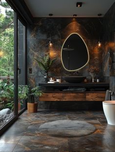 a bathroom with a large round mirror above the sink