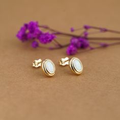 14K Gold Oval Opal Earrings 10x8mm, 14K Solid Gold Opal Studs are handcrafted in Solid Gold and Opal. Opal is the October Birthstone, so it makes an excellent gift for those born in October. Opal Earrings never go out of fashion. Opal Stud Earrings go well with casual and format styles, anywhere and anytime. Opal always stands out from other gemstones making it an eye-catching and style elevator.  Weight (Approximate): 1.6-1.7gr Dimensions: 10x8 mm Gemstone: Opal Material: 14K Gold (Real Solid G White Cabochon Earrings For Anniversary, Dainty White Opal Earrings, White Birthstone Earrings Fine Jewelry, White 14k Gold Birthstone Earrings, Gold Opal Cabochon Earrings, 14k Gold White Birthstone Earrings, Classic White Birthstone Earrings, Yellow Gold Opal Earrings Gift, Yellow Gold Opal Earrings For Gifts