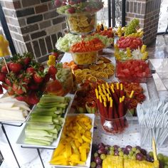 a table topped with lots of different types of fruits and veggies next to each other