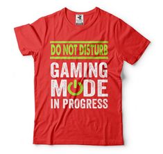 a red t - shirt that says, don't disturb gaming mode in progress