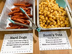 two trays filled with carrots and other food items on top of a wooden table