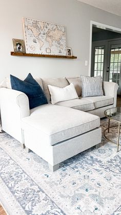 a living room filled with furniture and a rug