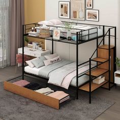 a bunk bed with drawers underneath it and pictures on the wall behind it in a bedroom