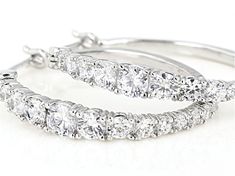 Bella Luce ® white diamond simulant 4.00ctw round, rhodium over sterling silver hoop earrings. Measure approximately 1.13"L x 0.13"W and have saddleback backings. The diamond equivalent weight is 2.28ctw. Man Made Diamonds, Diamond Simulant, Broken Chain, Sterling Silver Hoop Earrings, Sterling Silver Hoops, Silver Hoops, Silver Hoop Earrings, Quality Jewelry, Natural Crystals