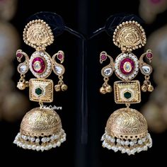 Flaunt this pair as it reflects an eternal classic culture! Beautiful earrings with colored stone & cluster pearl drops. Brass Based metal with gold finish. Style this with any Ethnic Wear and gather lot of compliments.  👉🏻Length: 4.5" light weight ✅Check other styles available in our store https://www.etsy.com/shop/KKsCulture 💕Send us an email if you need help! ✅ Contact Us: +1 (732) 325-2222 Luxury Fusion Earrings For Diwali, Luxury Festive Hallmarked Jhumkas, Festive Fusion Pearl Earrings With Latkans, Fusion Style Pearl Earrings With Latkans For Celebrations, Fusion Style Earrings For Wedding And Navratri, Heavy Temple Jewelry Pearl Earrings For Celebration, Celebration Temple Jewelry Pearl Earrings With Intricate Design, Festive Fusion Style Pearl Earrings With Intricate Design, Festive Fusion Pearl Earrings With Intricate Design