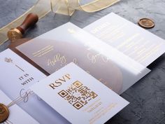 wedding stationery with gold foil on top and white paper in the middle, next to a wax seal