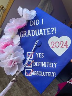 a blue graduation cap with flowers on it that says did i graduate? yes definitely absolutely