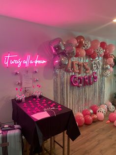 a party room with balloons and decorations