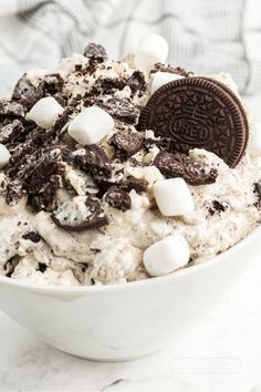 a bowl filled with ice cream and oreo cookies