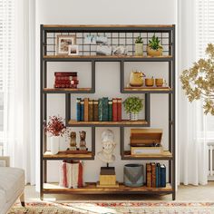 a bookshelf filled with lots of books next to a couch