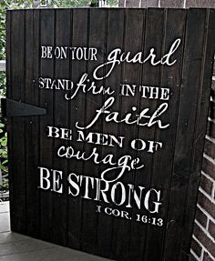 a sign on the side of a building that says be in your guard and stand firm in the faith