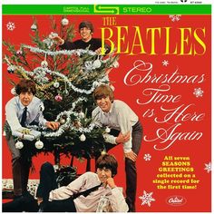 the beatles christmas time is here again album cover with an image of three men around a christmas tree