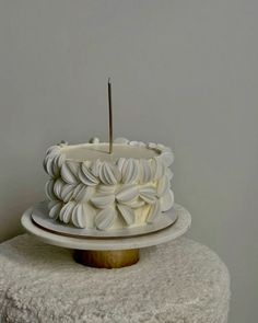 a white cake sitting on top of a table