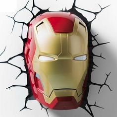 an iron man mask is shown through the cracked wall