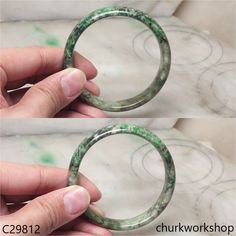 Grayish green mix light & dark green jade bangle•Inner: 58.6 mm•Width: 14.2 mm•Thickness: 7 mm•Weight: 49.3 grams •Color: Light green with splotches dark green•Translucency: Opaque•Shape: Round outer & Flat inner •Code: C29812 Symbolizes: Good luck, protection, longevity This hand carved jade bangle is guaranteed to be 100% natural, non-enhanced, and untreated. •We do our best to keep the photos the same as the item; these photos are not enhanced or edited. Please keep in mind that the color may vary on different monitors. •Should you find that this piece does not meet your expectations, we do accept returns within 7 days of receiving the product. However you must notify us within 24 hours of receiving the item. For more details on our Payment and/or Return policy, please visit the followi Grayish Green, Carved Jade, Jade Bangle, Jade Ring, Jade Bracelet, Jade Carving, Jade Stone, Green Jade, Jade Green