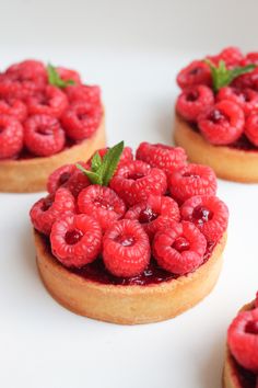 raspberry tarts are arranged on top of each other