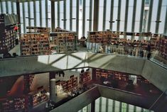 the inside of a library with many bookshelves