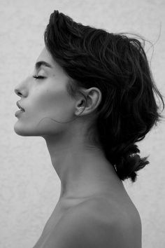 a black and white photo of a woman's profile