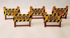 four pieces of construction signs sitting on top of each other in front of a white background