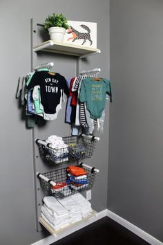 the closet is full of clothes and t - shirts hanging on it's shelves