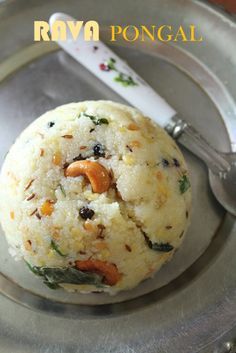 a silver plate topped with a pastry covered in toppings