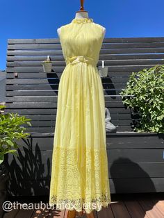 This Miss Elliette is done in a lemon yellow pleated chiffon overlay.  Yellow lace at neckline.  Yellow satin bow around waist with long ties in the front.  15.5" of yellow lace at hemline.  Dress zips up the back with metal hook at waist.  Unfortunately, this dress has some visible flaws.  Looks like the skirt was exposed to heat, and this caused puckering in the front, and back.  One very small brown dot found on skirt, and a hole on the back of skirt. See pics 8 & 9.  I noticed after taking p Yellow Satin, Chiffon Overlay, Pleated Chiffon, Yellow Lace, Chiffon Maxi, Chiffon Maxi Dress, Satin Bow, Lemon Yellow, Dress Clothes For Women