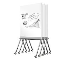 three whiteboards with metal legs and one has a drawing on the front, two are attached to each other