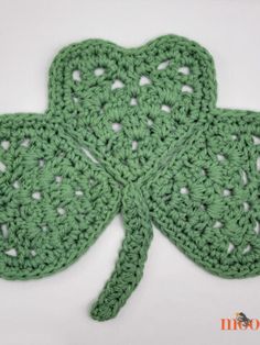 a crocheted shamrock with four leaf clovers on the front and back side