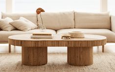 a coffee table sitting in front of a couch